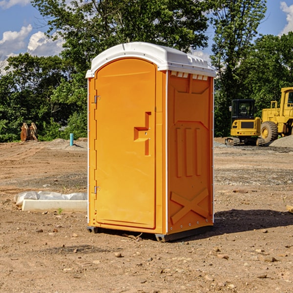 what is the cost difference between standard and deluxe portable restroom rentals in Walcott